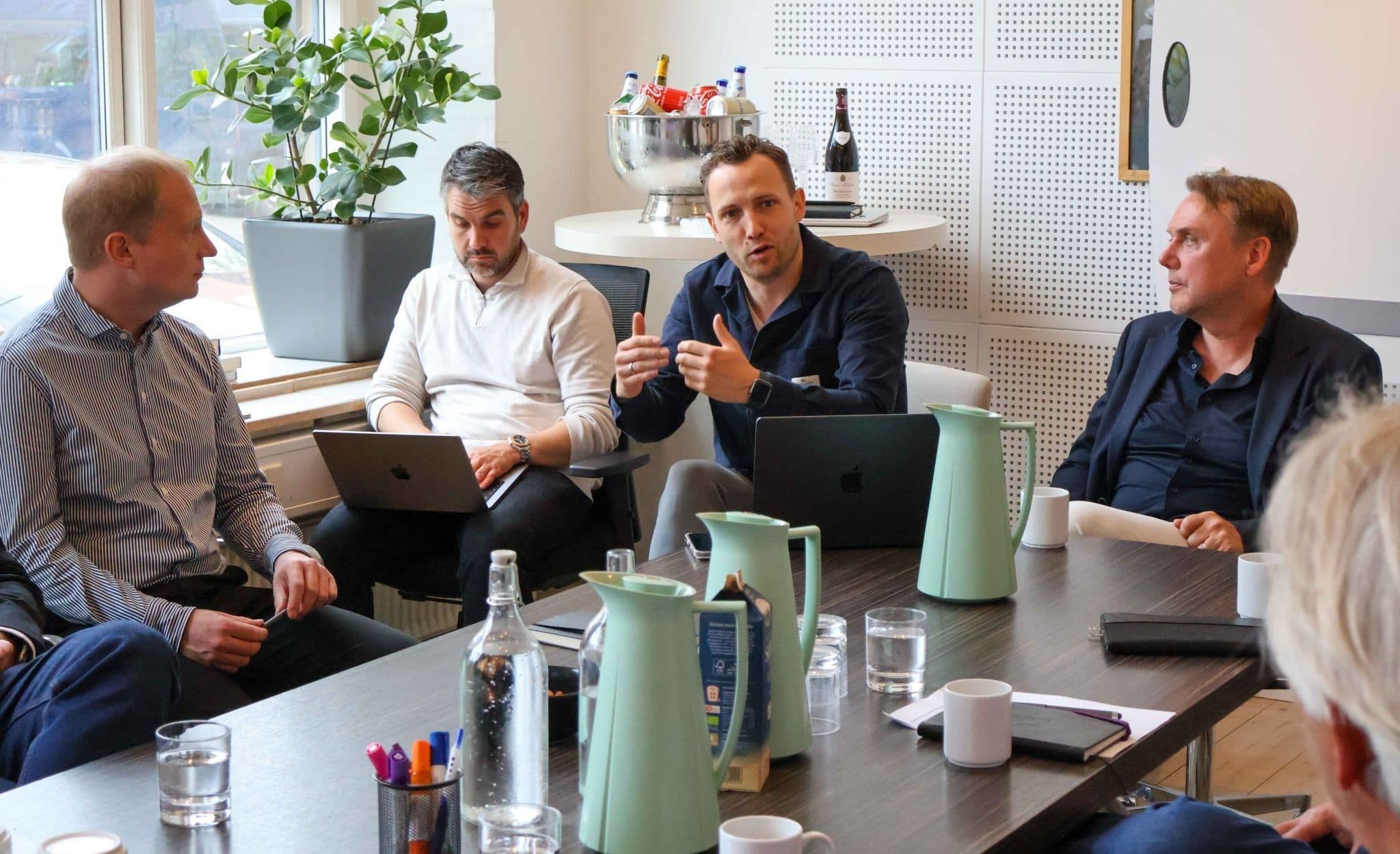 KRING partners and a founder around the table in a board discussion